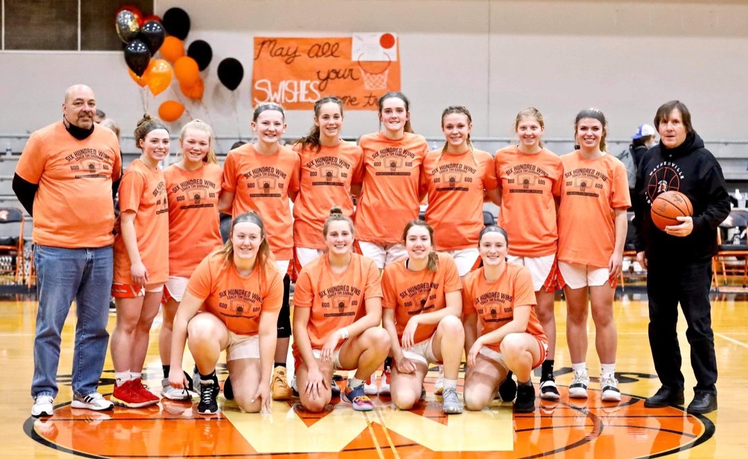 team all wearing orange shirts